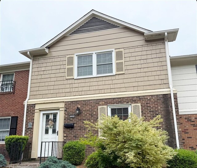 view of front of home with brick siding