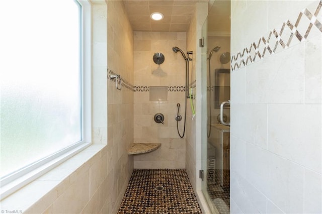 full bath with a shower stall