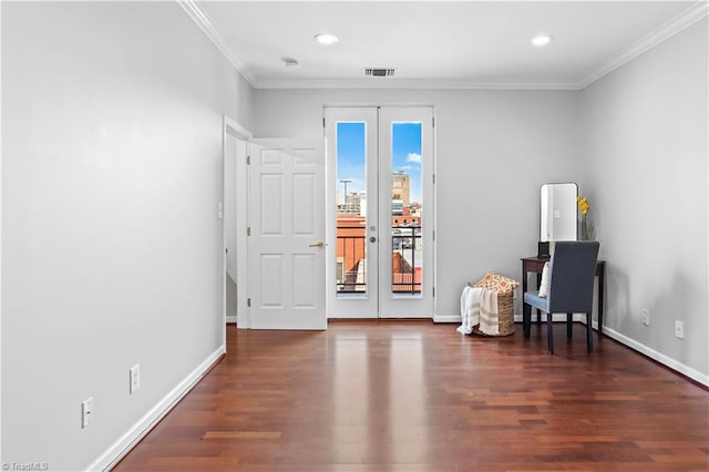 sitting room with baseboards, visible vents, ornamental molding, wood finished floors, and french doors