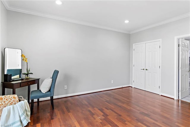 office space featuring baseboards, wood finished floors, and ornamental molding