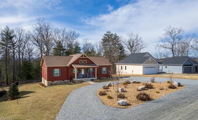 view of front of property featuring a front yard and a garage