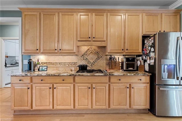 kitchen featuring stone counters, light brown cabinets, backsplash, appliances with stainless steel finishes, and ornamental molding