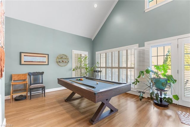 playroom featuring light hardwood / wood-style floors, high vaulted ceiling, plenty of natural light, and pool table