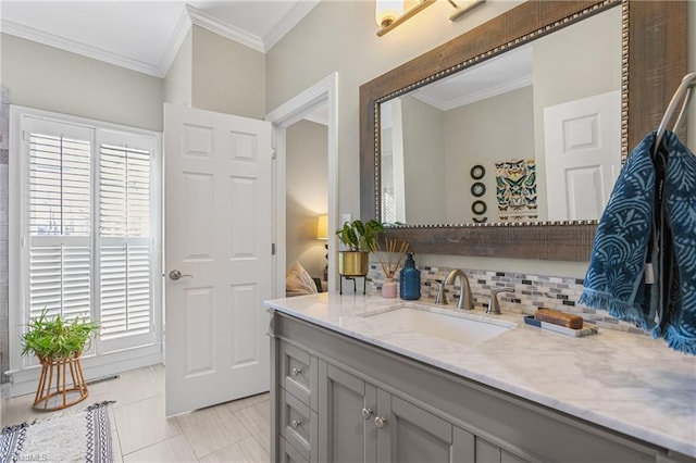 bathroom featuring vanity, tile patterned floors, a wealth of natural light, and crown molding