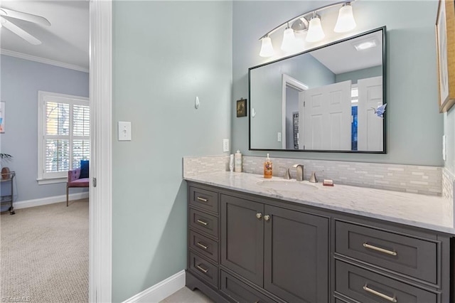 bathroom featuring vanity, tasteful backsplash, ceiling fan, and crown molding