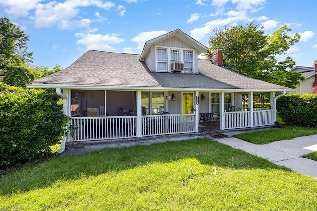 7387 NC Highway 62, Trinity, NC 27370 - view of front of home featuring a front yard, covered porch, a chimney, and a shingled roof