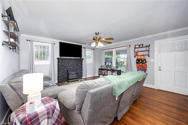 7387 NC Highway 62, Trinity, NC 27370 - living area featuring plenty of natural light, a ceiling fan, crown molding, a stone fireplace, and wood finished floors