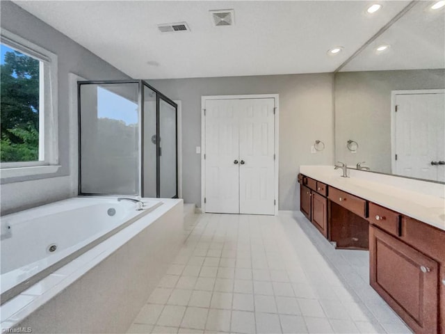 full bathroom with recessed lighting, vanity, visible vents, a shower stall, and a tub with jets