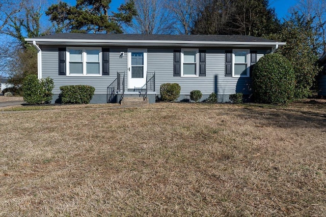 single story home featuring a front yard