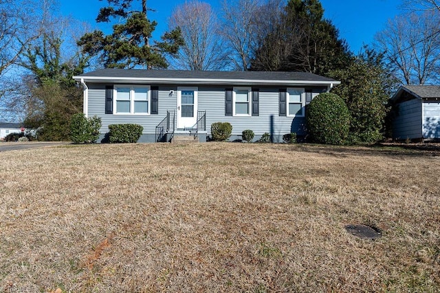 single story home featuring a front yard