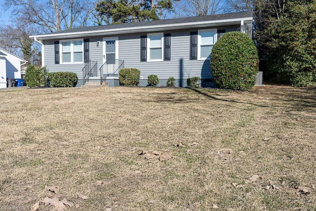 single story home with a front lawn