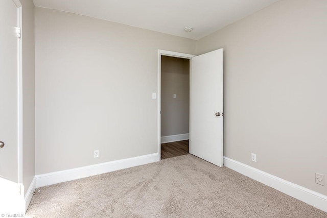 spare room featuring carpet flooring