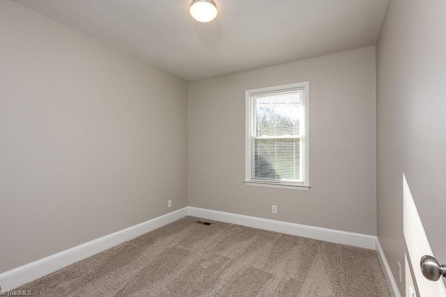 unfurnished room with carpet