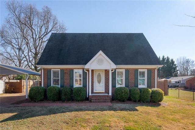 new england style home featuring a front lawn and a carport