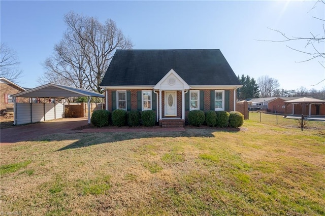 cape cod home with a carport and a front lawn