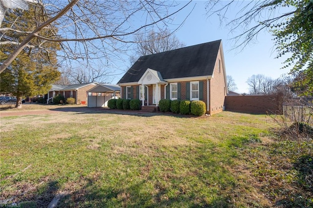 new england style home with a front yard and a garage