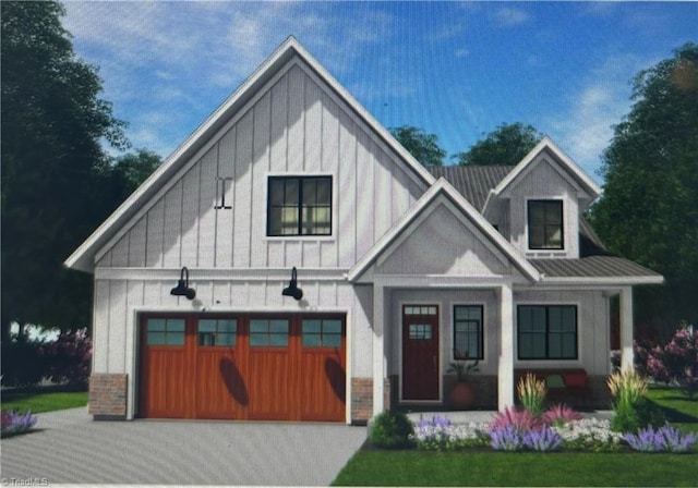 modern farmhouse featuring board and batten siding, metal roof, a garage, and aphalt driveway