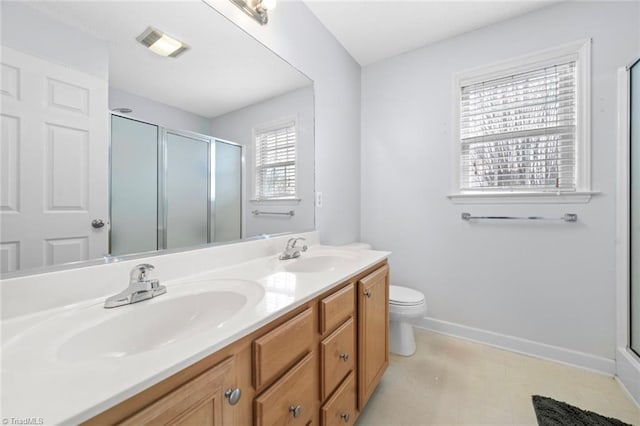 bathroom featuring a shower stall, visible vents, and a sink