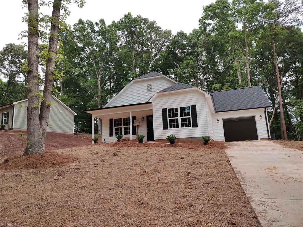 view of front of house with a porch and a garage