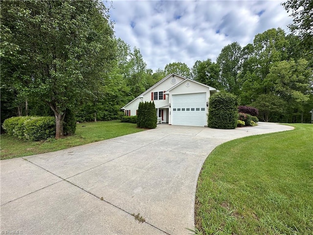 view of front of home with a garage and a front yard