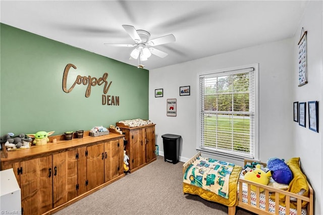 carpeted bedroom with ceiling fan