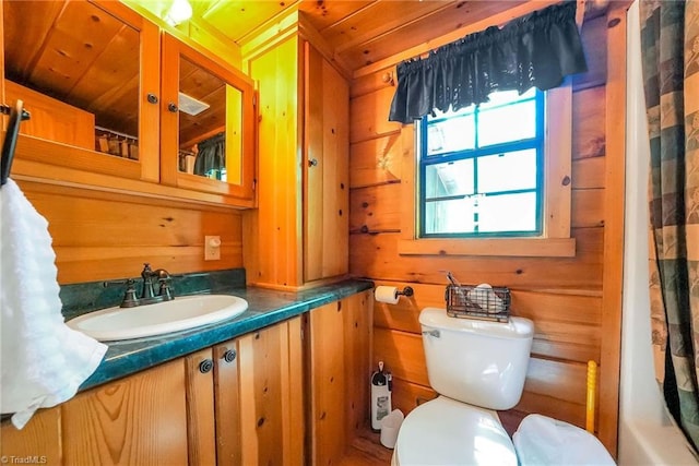 bathroom with wood ceiling, wooden walls, curtained shower, and toilet