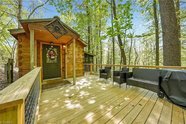 wooden terrace featuring area for grilling