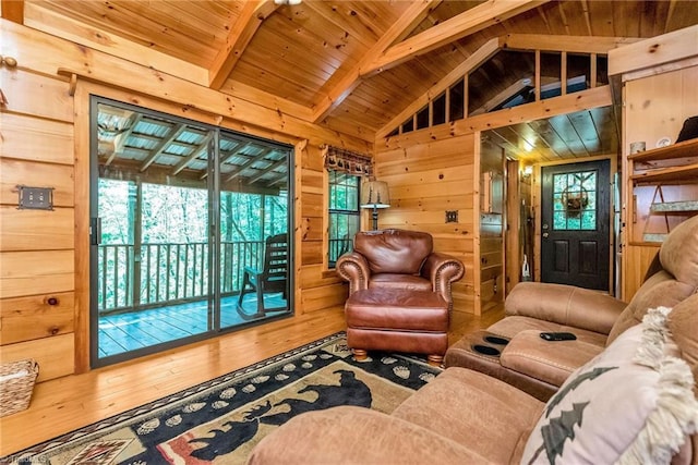 living room with hardwood / wood-style flooring, vaulted ceiling with beams, wood ceiling, and wood walls