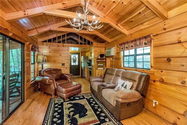 living room featuring wood walls, a wall mounted AC, lofted ceiling with beams, wooden ceiling, and light wood-type flooring