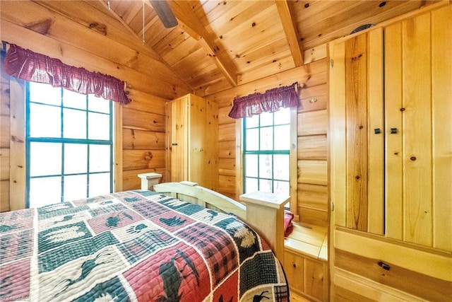 bedroom with wood ceiling, lofted ceiling with beams, and wood walls