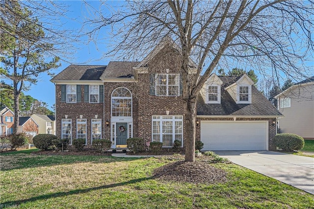 view of front of property featuring a garage and a front yard