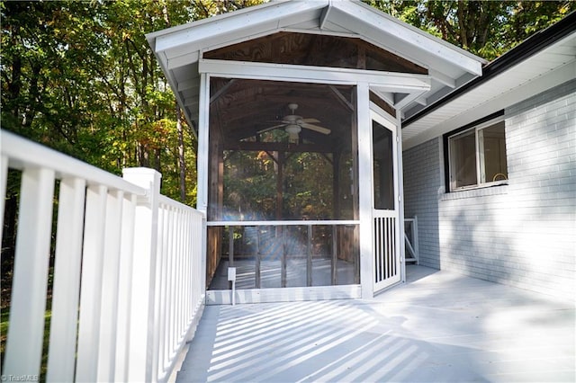 exterior space featuring a sunroom and a ceiling fan