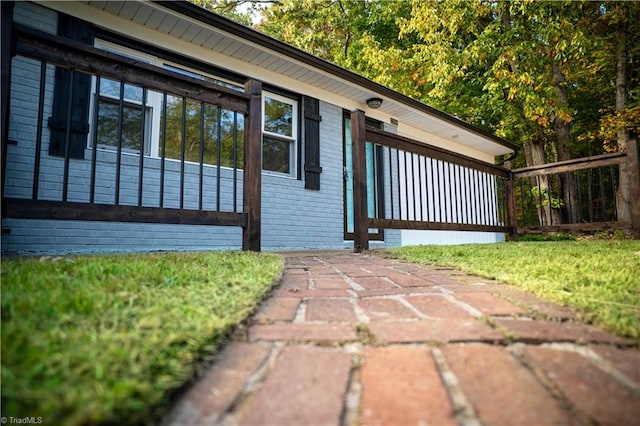 view of side of home featuring brick siding