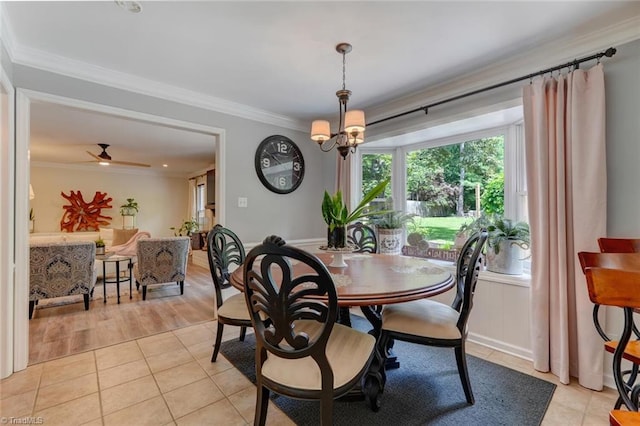 dining area with ornamental molding, light tile patterned floors, and a chandelier