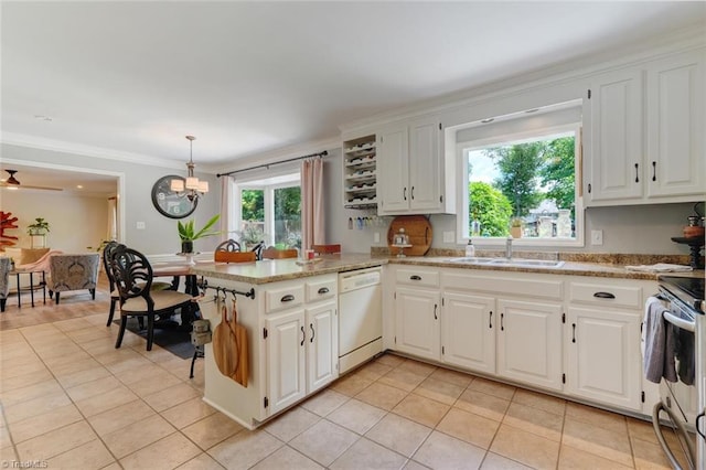 kitchen featuring white dishwasher, a sink, light tile patterned flooring, a peninsula, and white cabinets