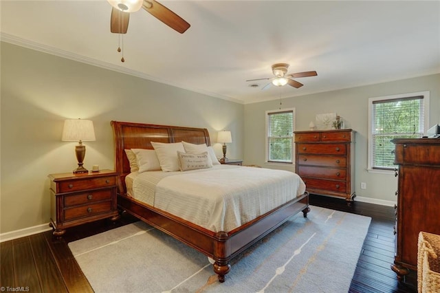 bedroom with dark wood-style flooring, baseboards, crown molding, and ceiling fan
