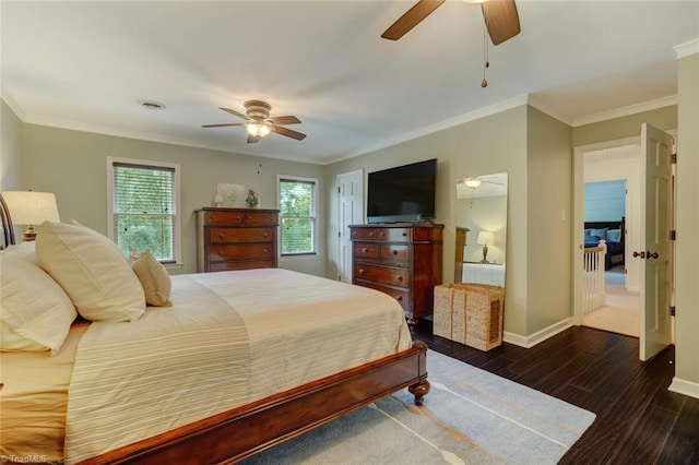 bedroom featuring wood finished floors, baseboards, crown molding, and a ceiling fan