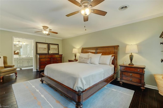 bedroom featuring wood finished floors, crown molding, baseboards, ensuite bathroom, and ceiling fan