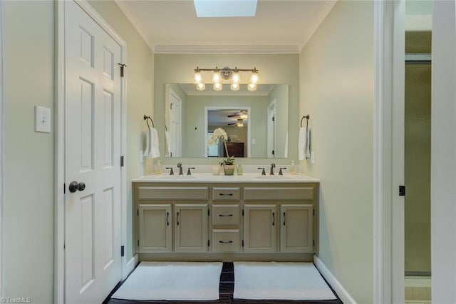 full bath with double vanity, crown molding, and ensuite bath