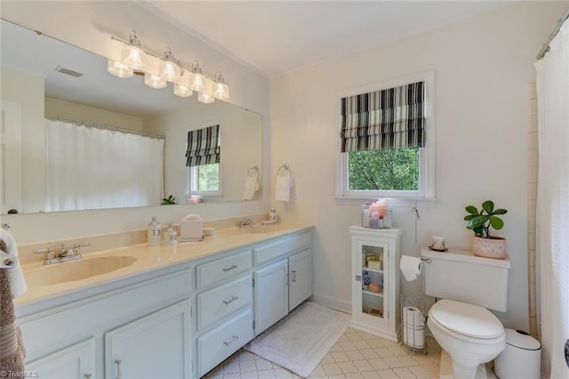 full bath featuring toilet, double vanity, and curtained shower