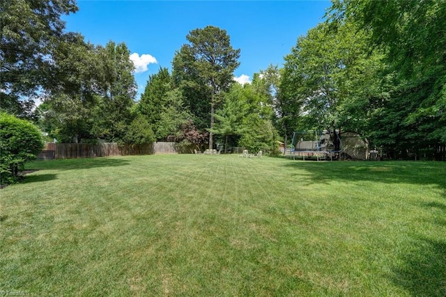 view of yard with a trampoline