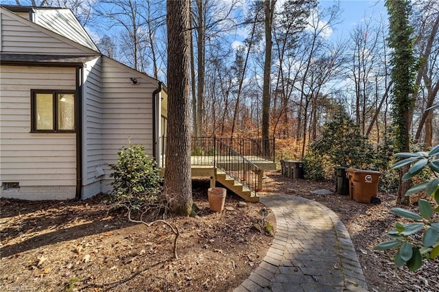 view of yard featuring a wooden deck