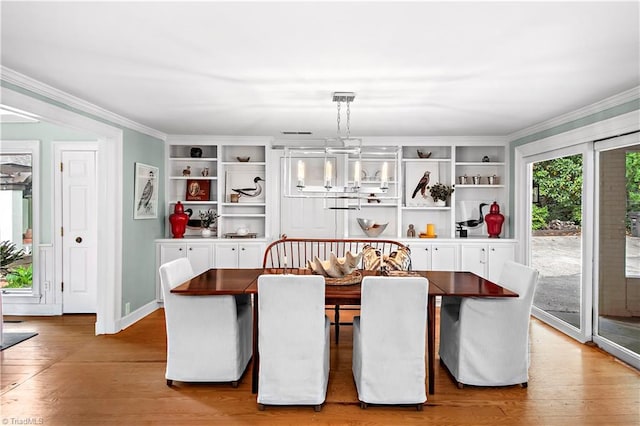 968 Avon Rd, Winston-Salem, NC 27104 - dining area featuring light wood-style flooring, crown molding, and baseboards