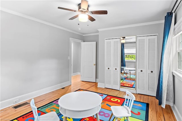 968 Avon Rd, Winston-Salem, NC 27104 - game room with hardwood / wood-style flooring, a ceiling fan, baseboards, and crown molding