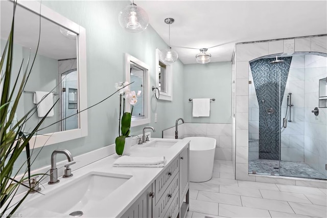 968 Avon Rd, Winston-Salem, NC 27104 - full bathroom with a shower stall, a freestanding tub, and double vanity