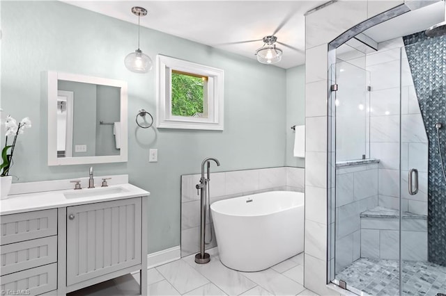 968 Avon Rd, Winston-Salem, NC 27104 - bathroom featuring a stall shower, vanity, a freestanding bath, and marble finish flooring