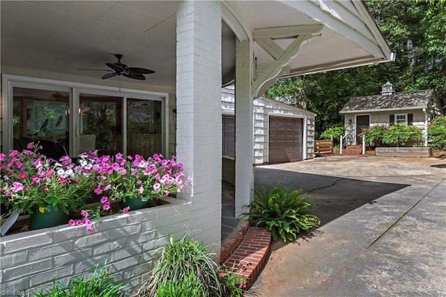 968 Avon Rd, Winston-Salem, NC 27104 - view of patio / terrace featuring an outdoor structure, a ceiling fan, driveway, and a detached garage