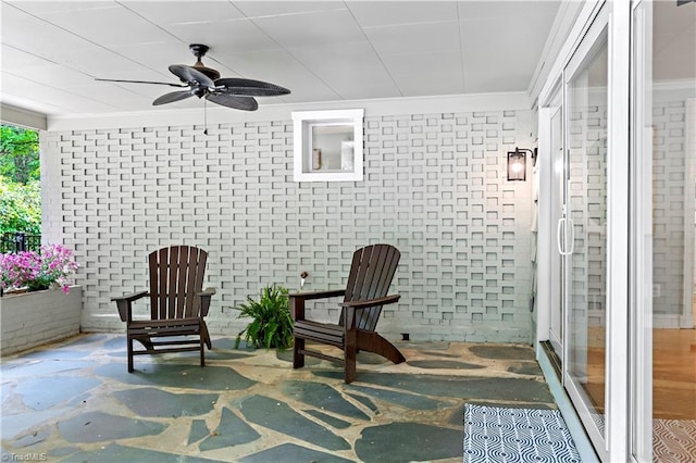 968 Avon Rd, Winston-Salem, NC 27104 - living area with a ceiling fan, ornamental molding, and brick wall