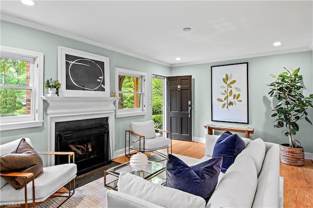 968 Avon Rd, Winston-Salem, NC 27104 - living room with a fireplace with flush hearth, wood finished floors, crown molding, recessed lighting, and baseboards