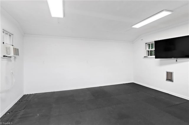 968 Avon Rd, Winston-Salem, NC 27104 - spare room featuring lofted ceiling, a wall mounted AC, and baseboards